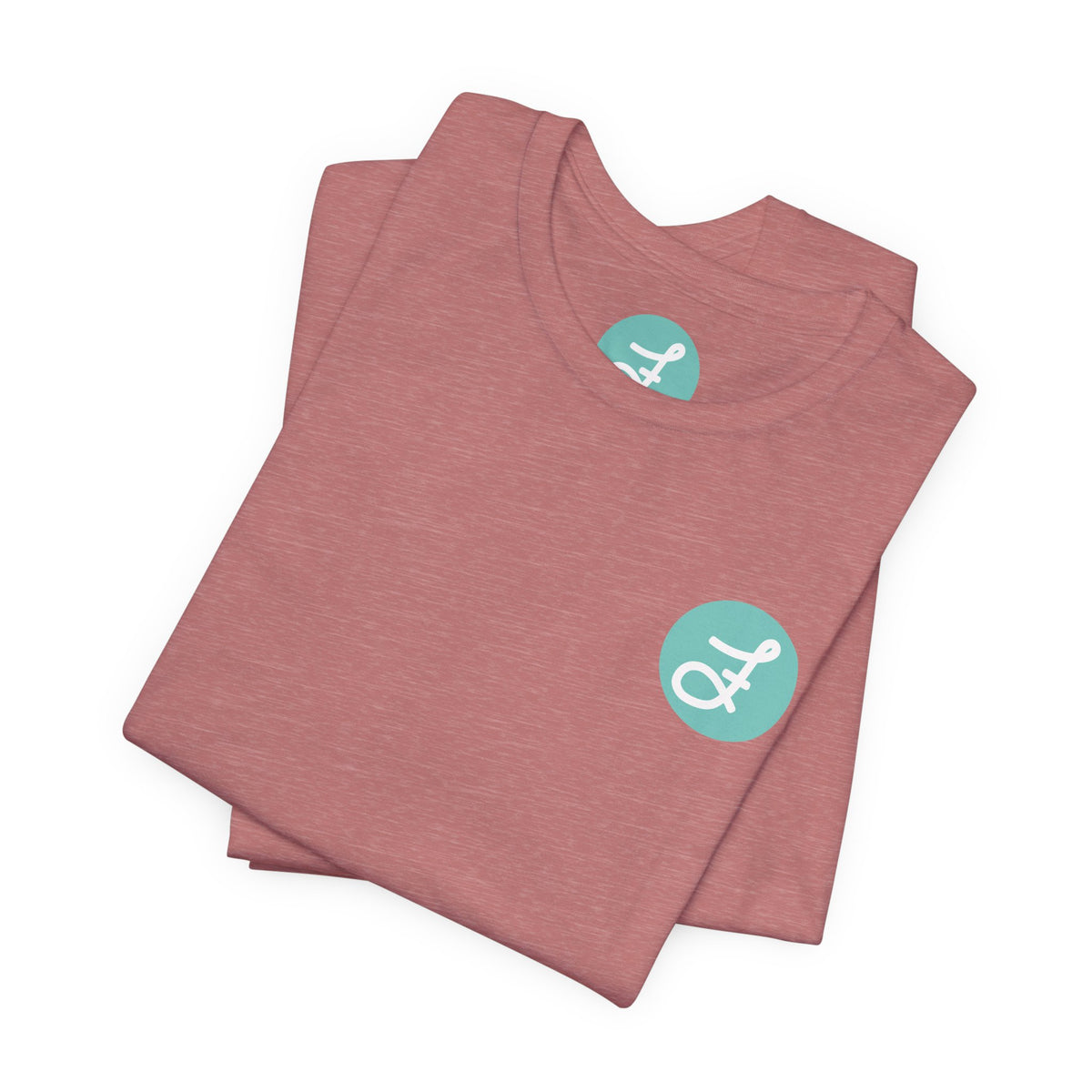 Frannie's Coffee Princeton, BC t-shirt in Heather Mauve: folded, showing the F logo and printed neck label