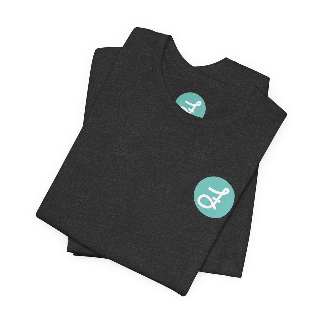 Frannie's Coffee Princeton, BC t-shirt in Dark Grey Heather: folded, showing the F logo and printed neck label