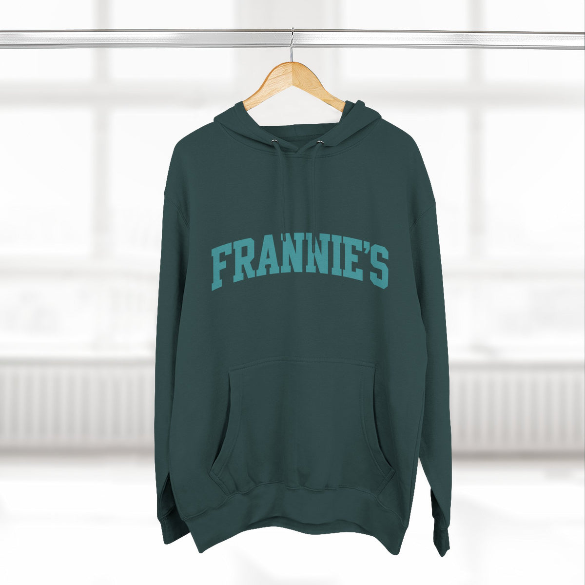 Frannie's varsity hoodie in Sports Green: on a hanger