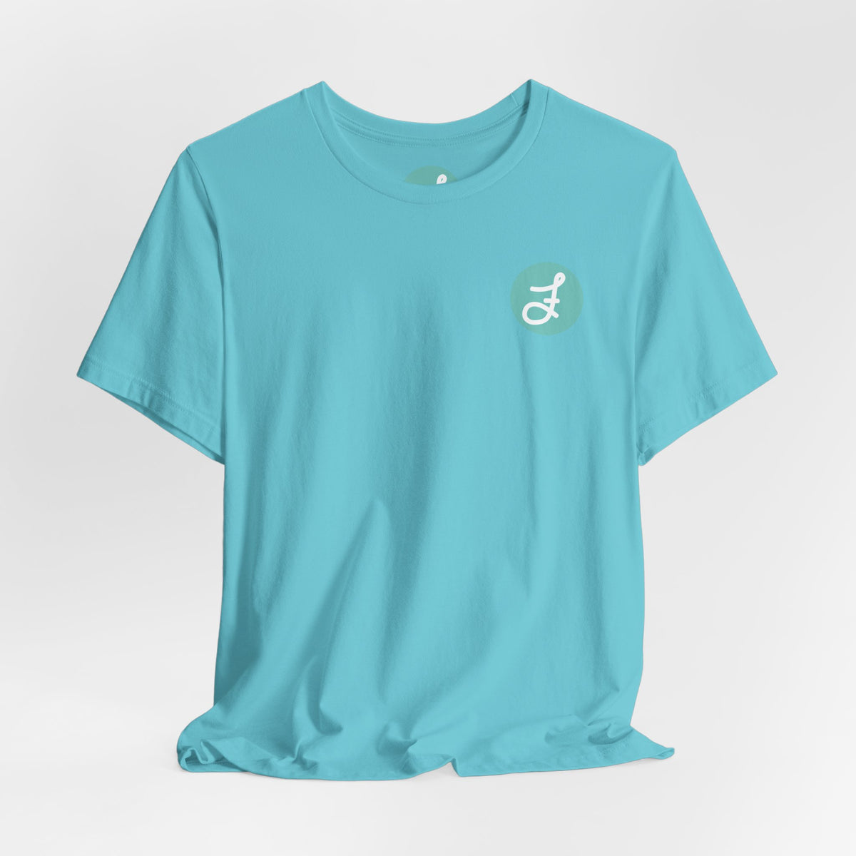 Frannie's Coffee Princeton, BC t-shirt in Turquoise: front with the F logo on the left chest