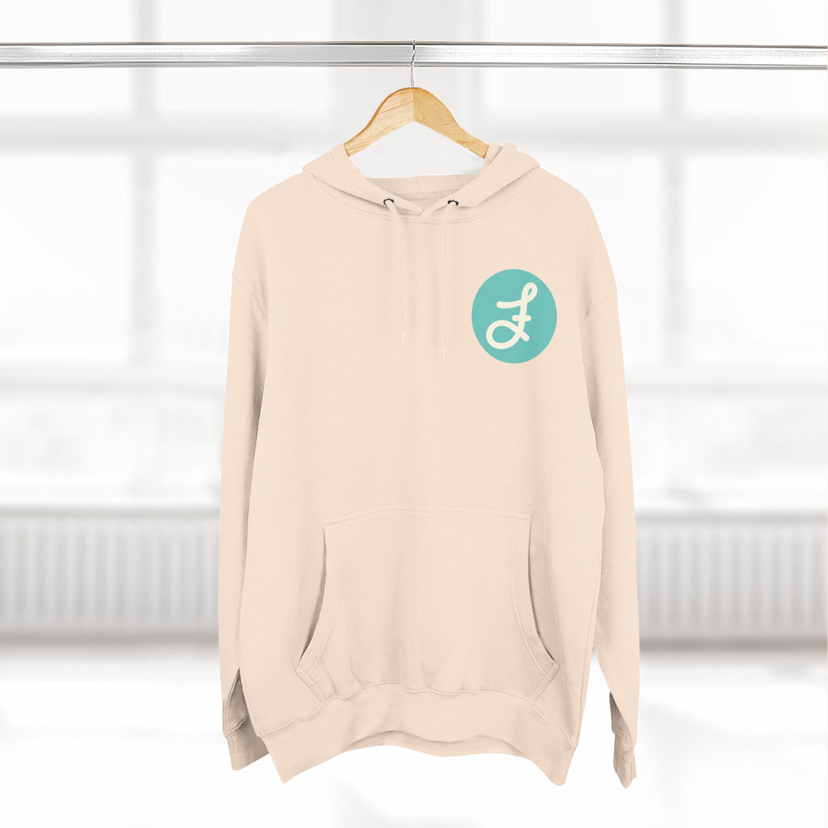 Frannie's Coffee logo hoodie in Pale Pink: on a hanger