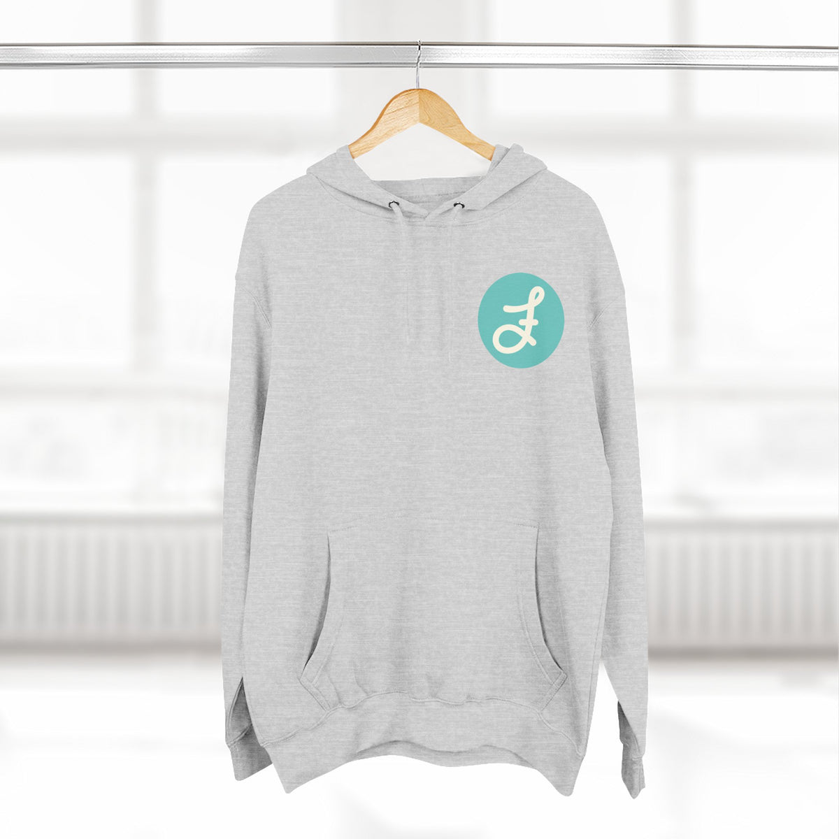 Frannie's Coffee logo hoodie in Heather Grey: on a hanger