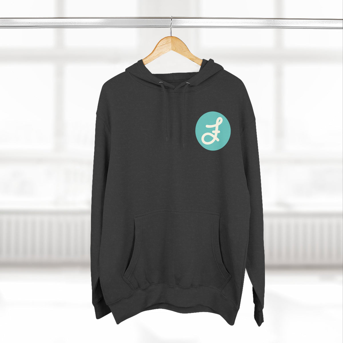 Frannie's Coffee logo hoodie in Charcoal Heather: on a hanger