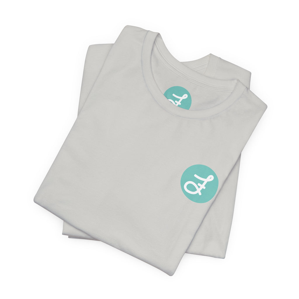 Frannie's Coffee Princeton, BC t-shirt in Silver: folded, showing the F logo and printed neck label