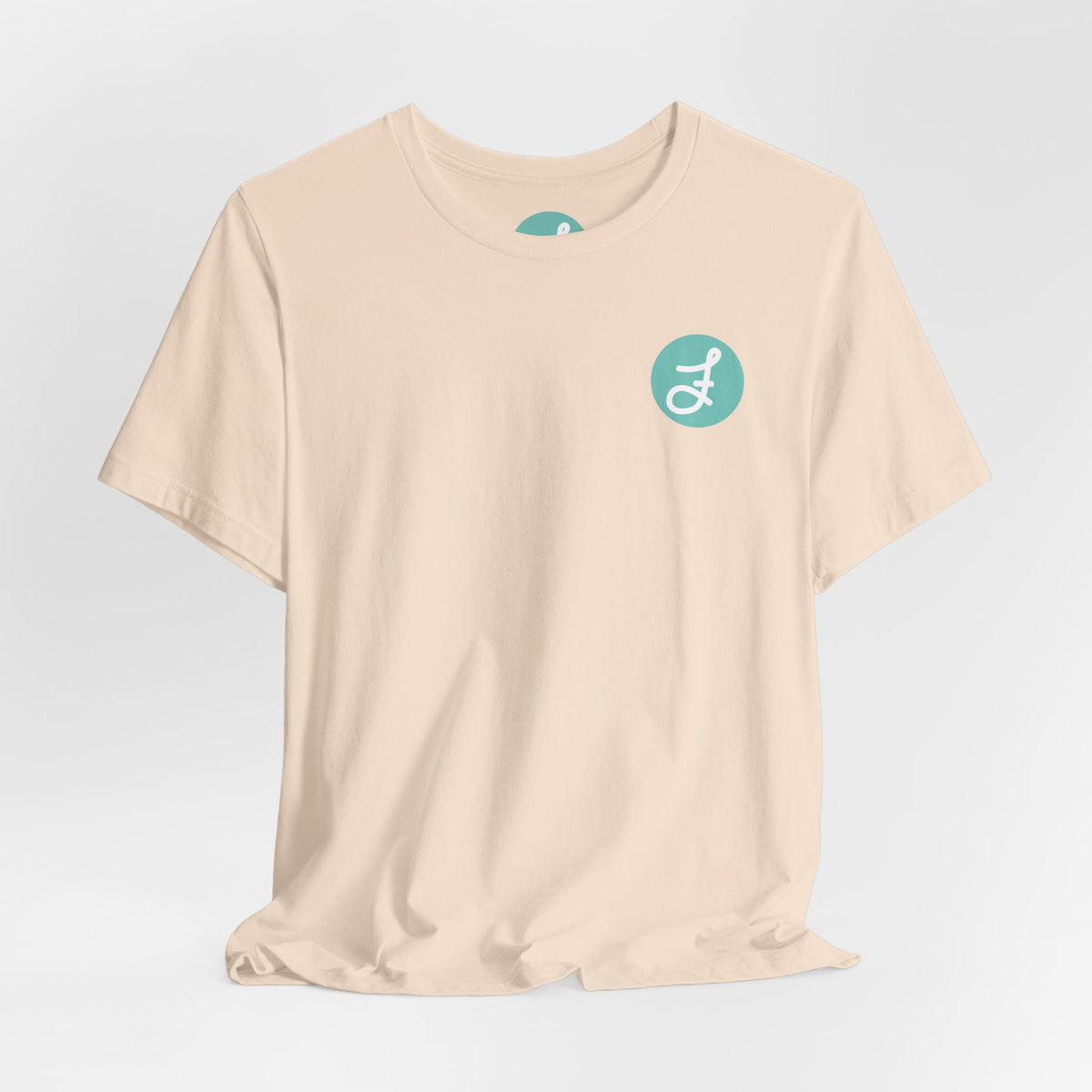 Frannie's Coffee Princeton, BC t-shirt in Soft Cream: front with the F logo on the left chest