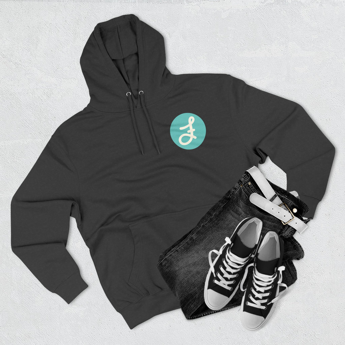 Frannie's Coffee logo hoodie in Charcoal Heather: laid flat with jeans and sneakers