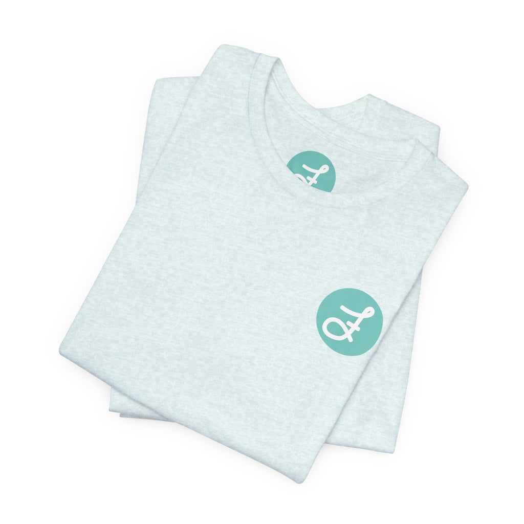 Frannie's Coffee Princeton, BC t-shirt in Heather Ice Blue: folded, showing the F logo and printed neck label