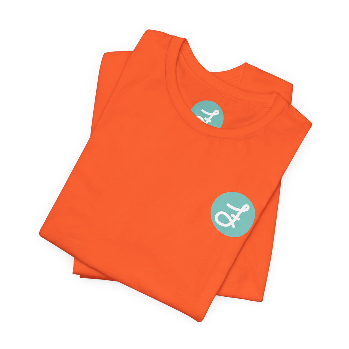 Frannie's Coffee Princeton, BC t-shirt in Orange: folded, showing the F logo and printed neck label