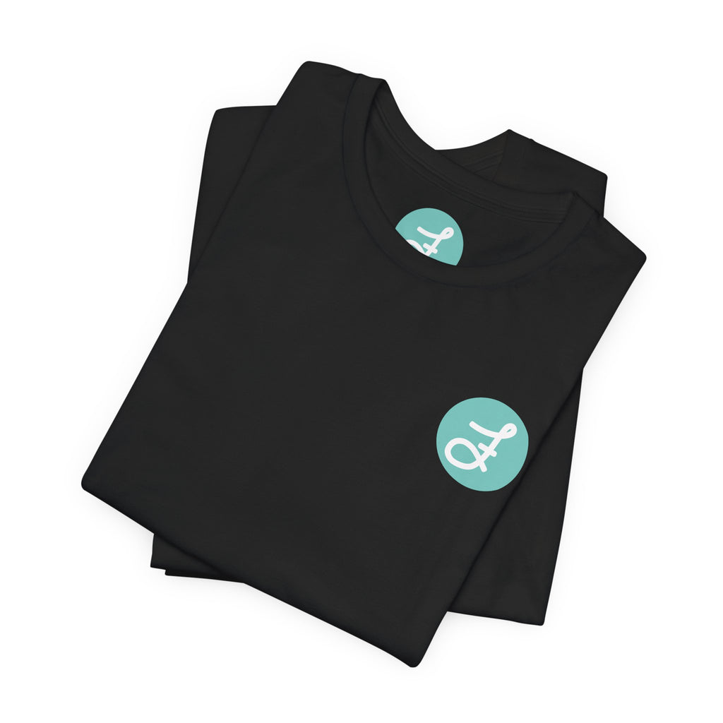 Frannie's Coffee Princeton, BC t-shirt in Black: folded, showing the F logo and printed neck label