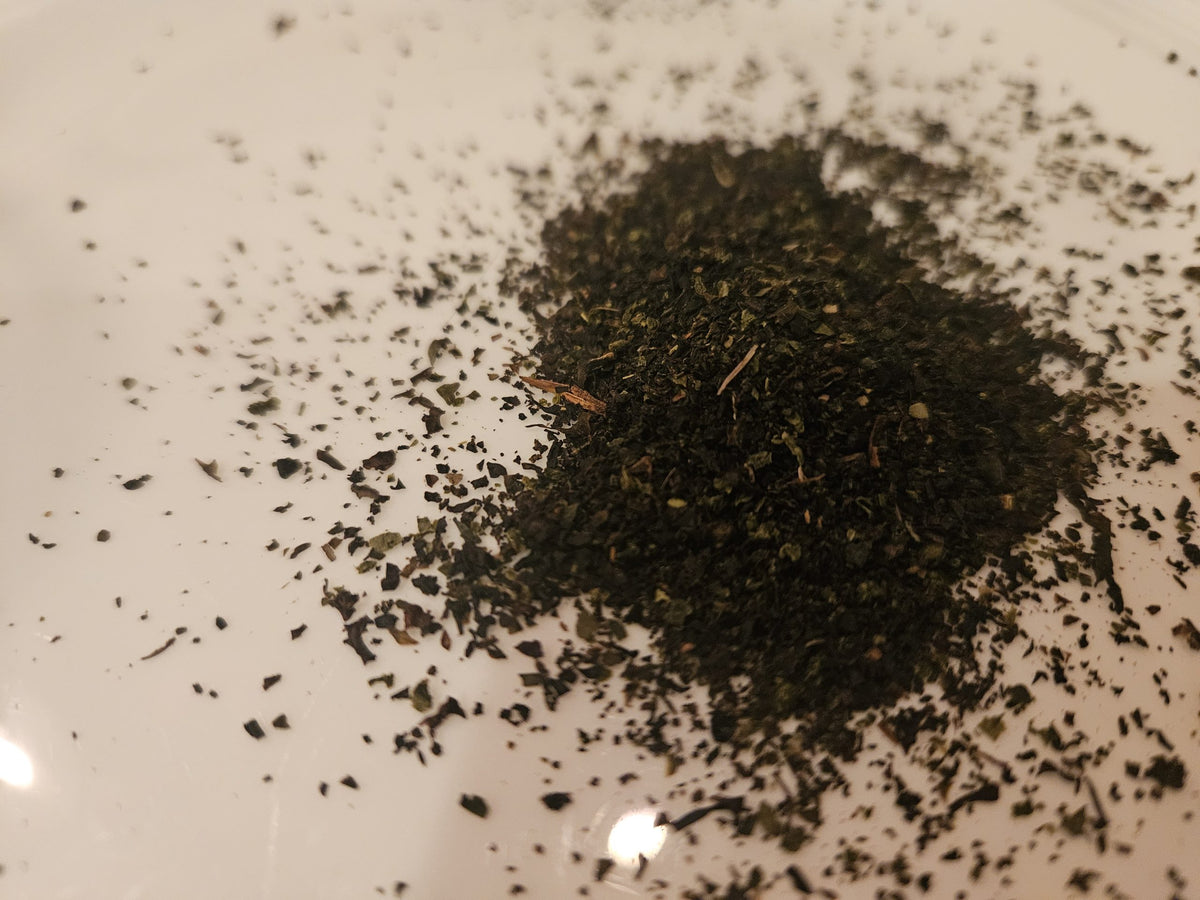 Double Cream of Earl Grey loose tea leaves on a white plate