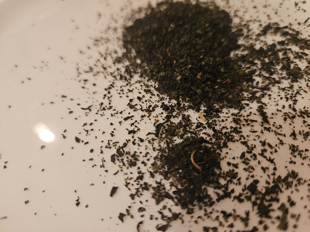 Tulameen Breakfast loose black tea leaves on a white plate