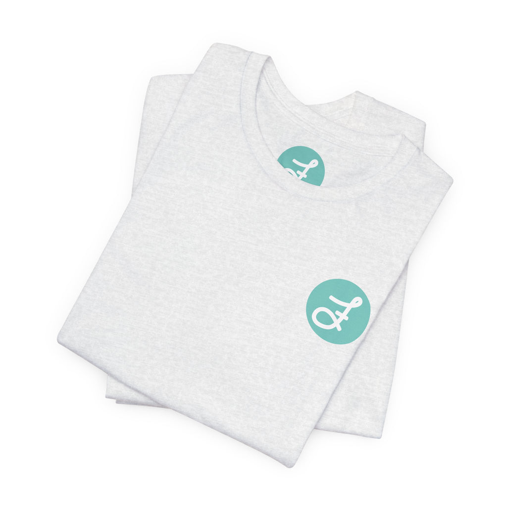 Frannie's Coffee Princeton, BC t-shirt in Ash: folded, showing the F logo and printed neck label