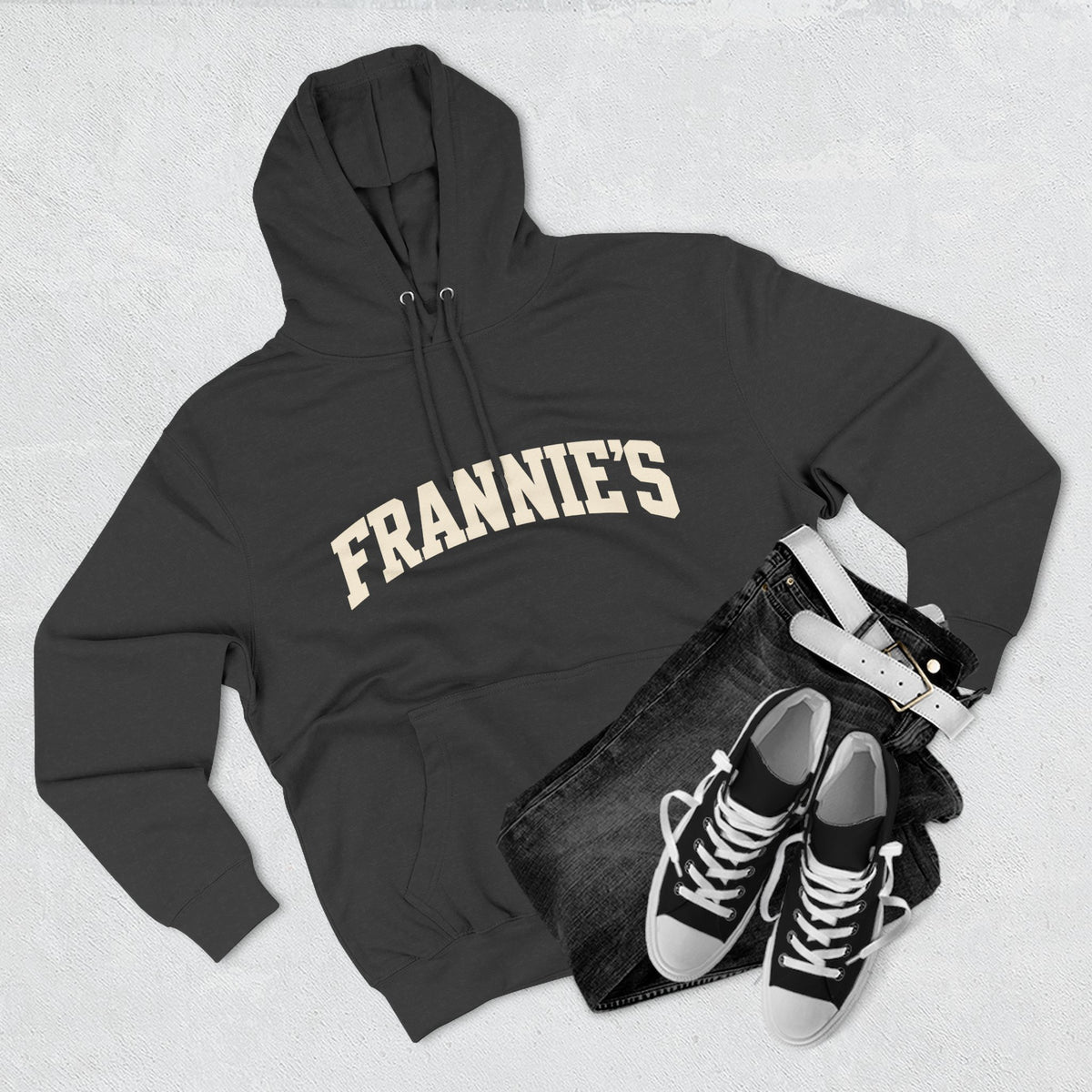 Frannie's varsity hoodie in Charcoal Heather: laid flat with jeans and sneakers