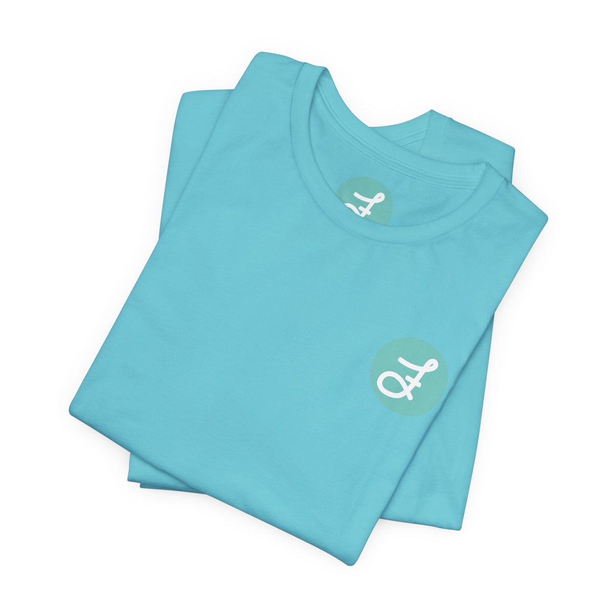 Frannie's Coffee Princeton, BC t-shirt in Turquoise: folded, showing the F logo and printed neck label