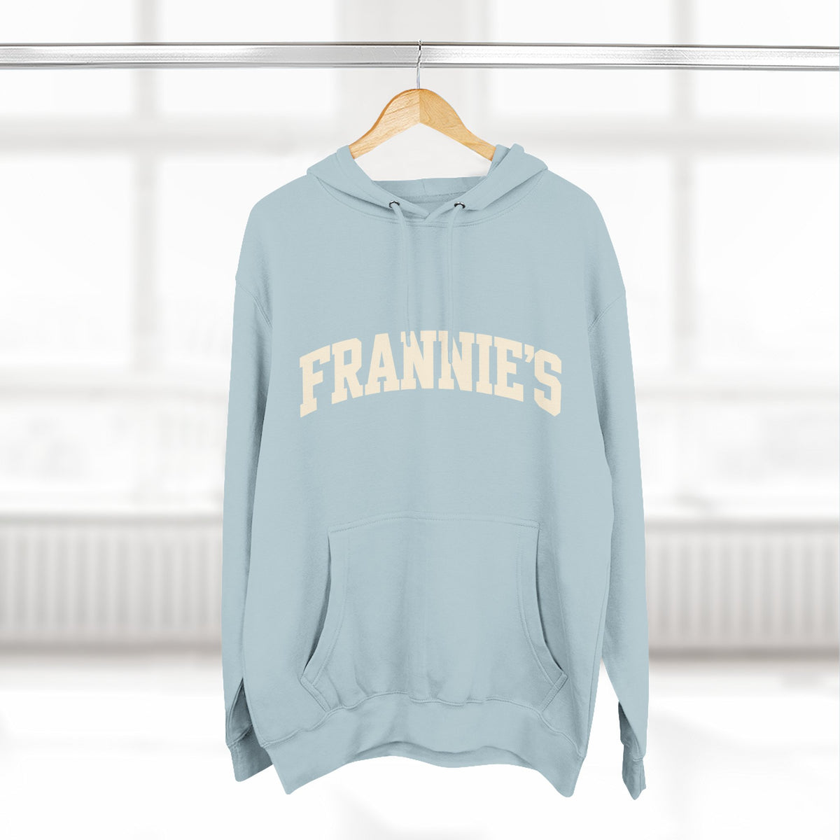 Frannie's varsity hoodie in Blue Mist: on a hanger