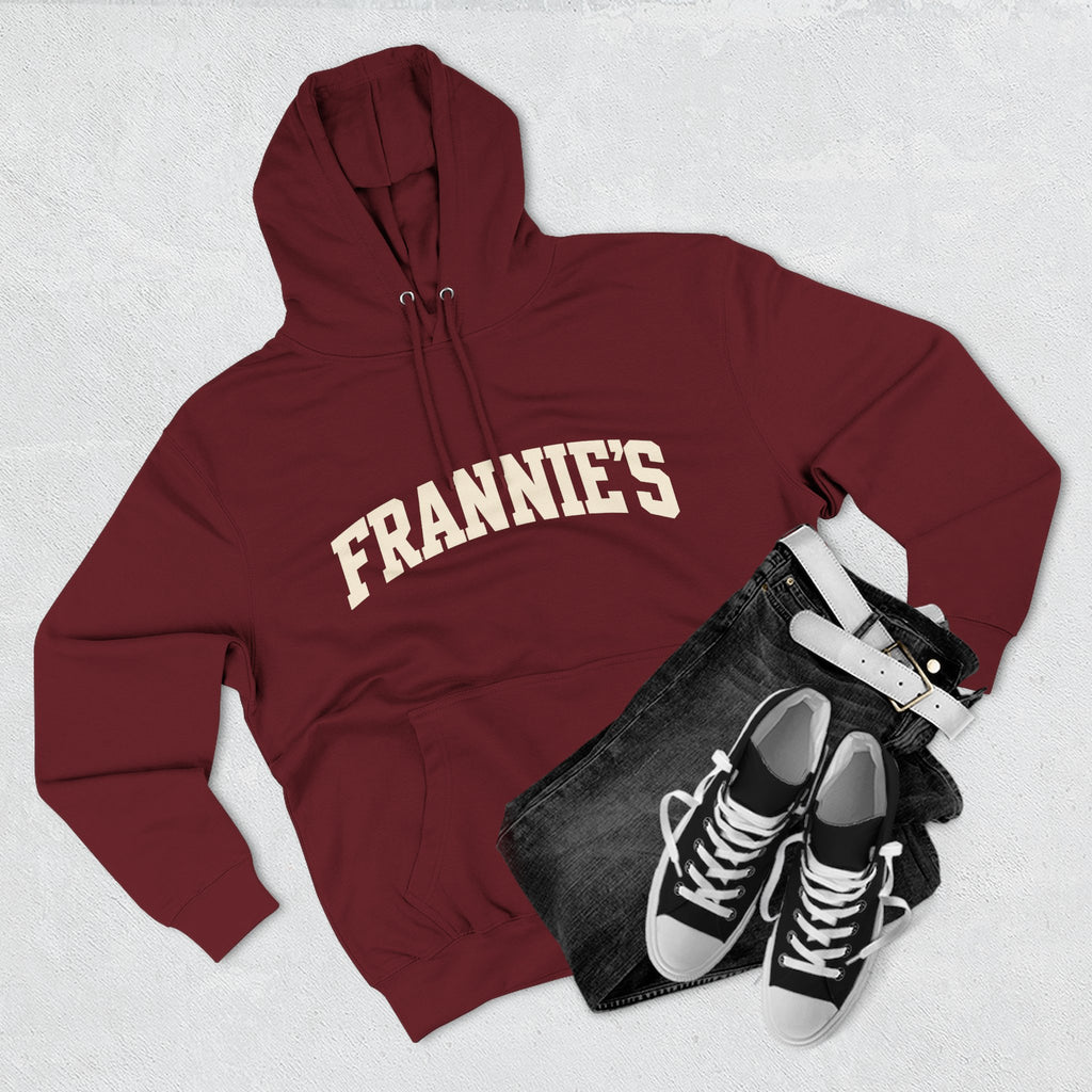 Frannie's varsity hoodie in Burgundy: laid flat with jeans and sneakers