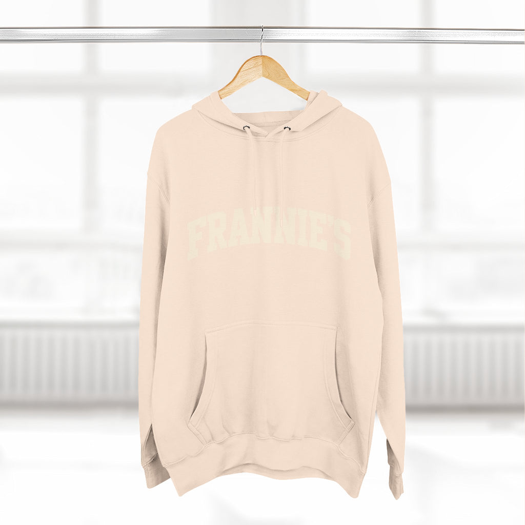 Frannie's varsity hoodie in Pale Pink: on a hanger