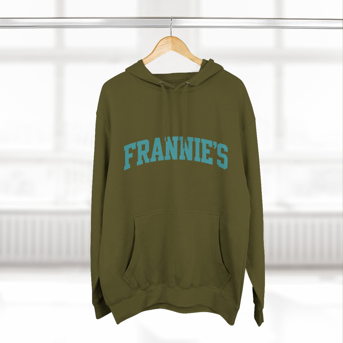 Frannie's varsity hoodie in Army Green: on a hanger