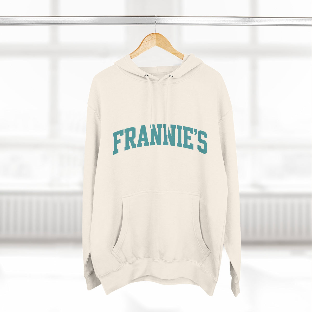 Frannie's varsity hoodie in Sandshell: on a hanger